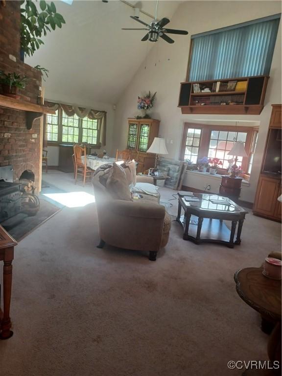 1720 Linda Carol Dr, Powhatan, VA 23139 - carpeted living room featuring ceiling fan and high vaulted ceiling