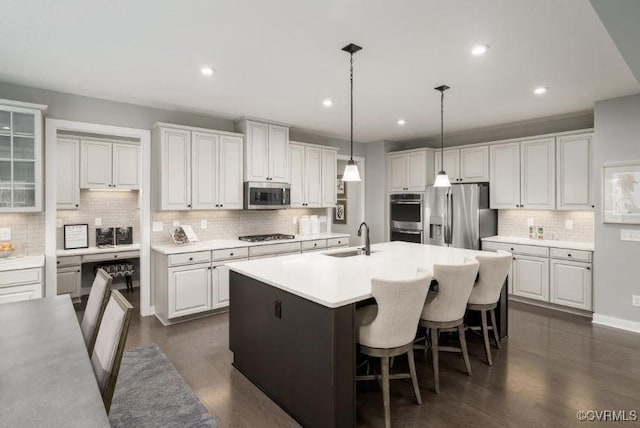 1 Abercrombie Dr, Chesterfield, VA 23838 - kitchen featuring appliances with stainless steel finishes, a sink, backsplash, a center island with sink, and light countertops