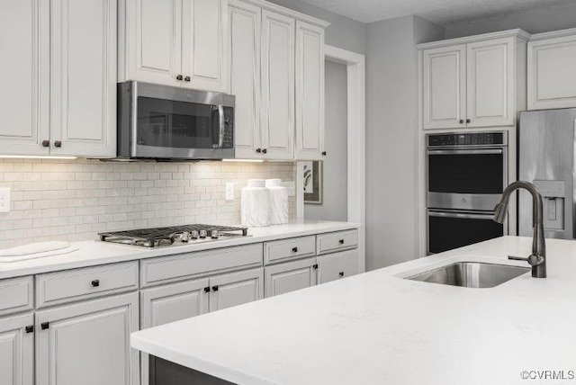 1 Abercrombie Dr, Chesterfield, VA 23838 - kitchen featuring stainless steel appliances, a sink, white cabinetry, light countertops, and decorative backsplash