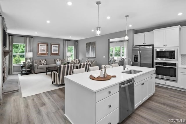 6 Abercrombie Dr, Chesterfield, VA 23838 - kitchen with appliances with stainless steel finishes, a sink, open floor plan, recessed lighting, and a kitchen island with sink