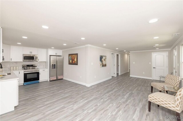 1701 Arlington Rd, Hopewell, VA 23860 - kitchen with crown molding, appliances with stainless steel finishes, and recessed lighting