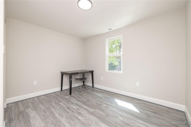 1701 Arlington Rd, Hopewell, VA 23860 - spare room with baseboards, wood finished floors, and visible vents