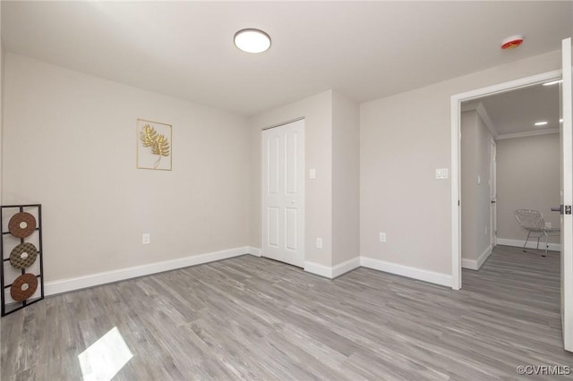 1701 Arlington Rd, Hopewell, VA 23860 - unfurnished bedroom featuring baseboards, wood finished floors, and a closet