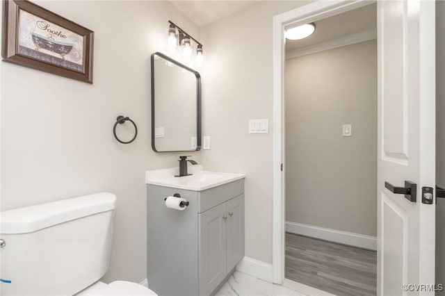 1701 Arlington Rd, Hopewell, VA 23860 - bathroom with vanity, toilet, marble finish floor, baseboards, and ornamental molding