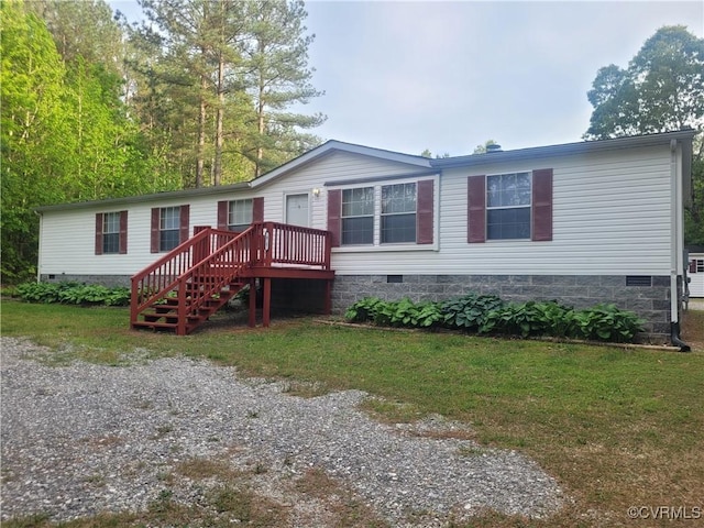 view of front of property featuring crawl space, a deck, stairs, and a front lawn