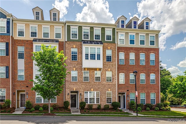 view of front of house featuring brick siding