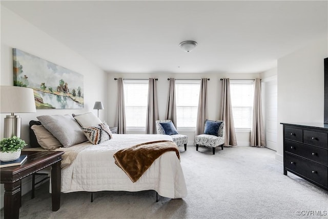 bedroom featuring light colored carpet