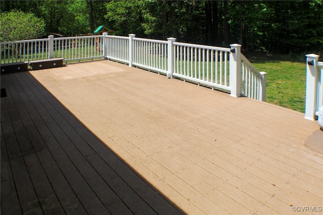 deck featuring a lawn