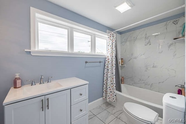 bathroom with baseboards, vanity, toilet, marble finish floor, and shower / bath combo with shower curtain