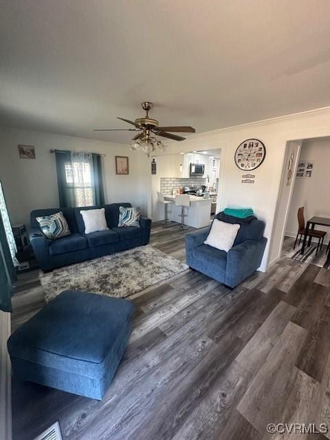 2789 Sussex Dr, Emporia, VA 23847 - living area with a ceiling fan and dark wood finished floors