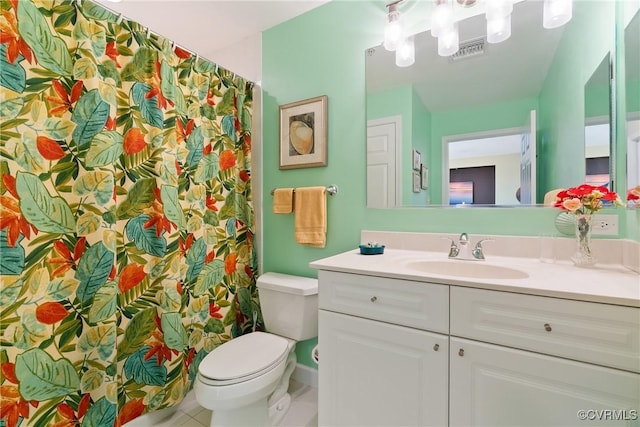 bathroom with toilet, tile patterned floors, visible vents, and vanity