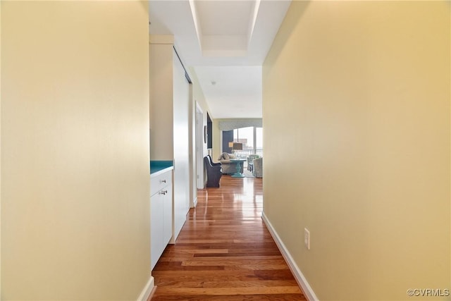corridor featuring wood finished floors