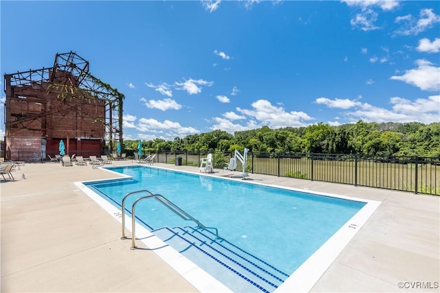 pool featuring a patio and fence