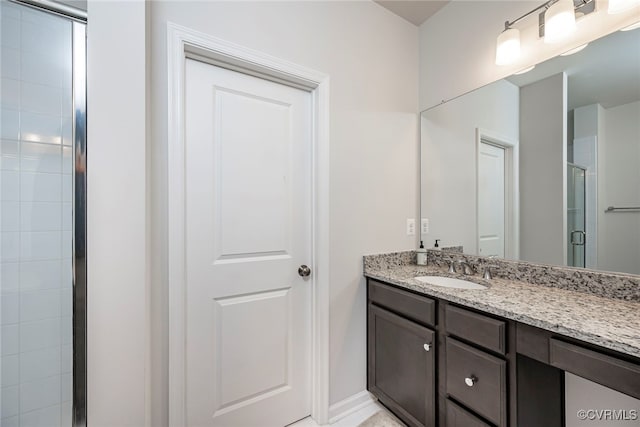 bathroom with vanity and a stall shower