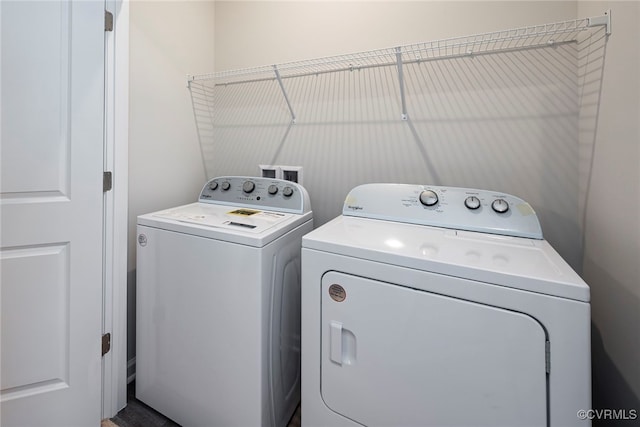 clothes washing area featuring washing machine and clothes dryer