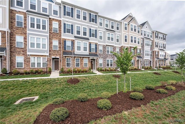 view of front of property with a residential view and a front yard