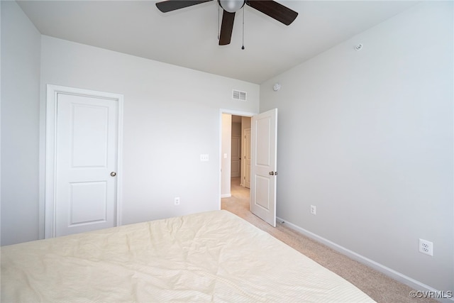 bedroom with baseboards, ceiling fan, light carpet, and visible vents