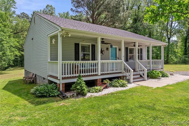view of front of property with ceiling fan, covered porch, a front lawn, and crawl space