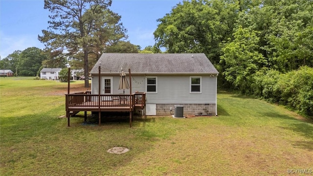 back of house with a wooden deck, cooling unit, a yard, crawl space, and roof with shingles