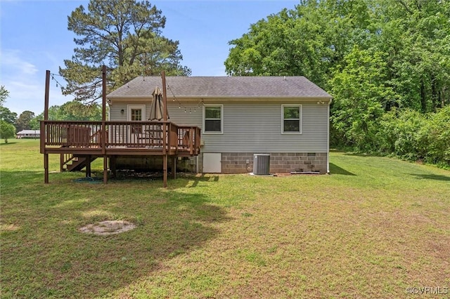 back of property featuring crawl space, a deck, central AC, and a lawn