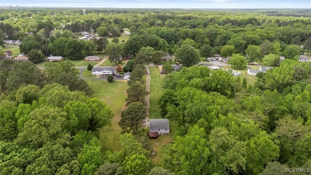 drone / aerial view featuring a view of trees