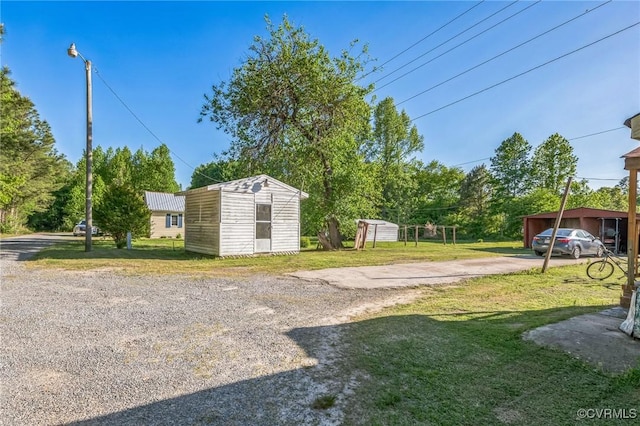 4591 Allen Rd, Jarratt, VA 23867 - view of yard with a storage unit and an outbuilding