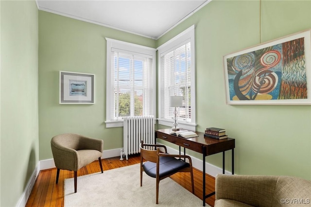 2218 Monument Ave, Richmond, VA 23220 - office area featuring radiator, ornamental molding, wood finished floors, and baseboards