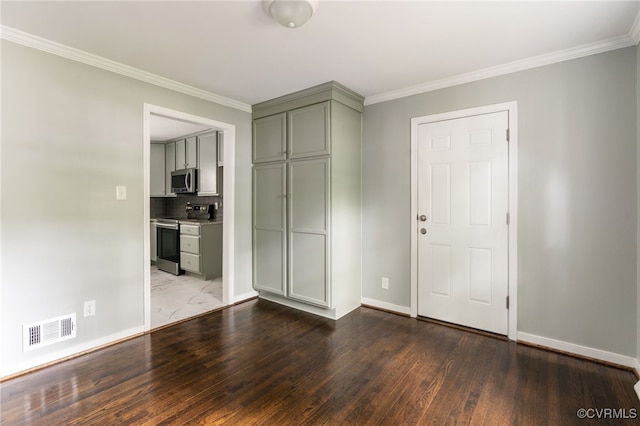 unfurnished bedroom featuring baseboards, ornamental molding, and visible vents