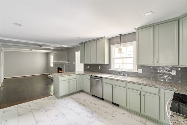 kitchen featuring backsplash, appliances with stainless steel finishes, a sink, marble finish floor, and green cabinetry