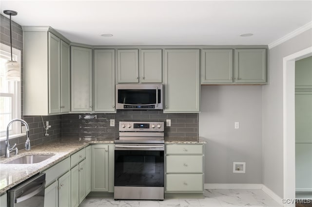 kitchen featuring appliances with stainless steel finishes, a sink, baseboards, light stone counters, and marble finish floor