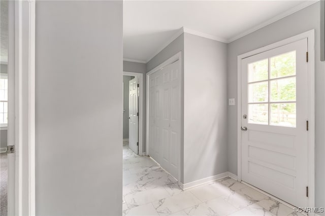 entryway featuring baseboards, ornamental molding, and marble finish floor