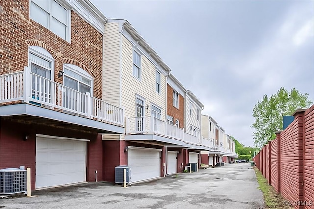 605 Spring St Unit P, Richmond, VA 23220 - view of property featuring an attached garage, central AC, and a residential view