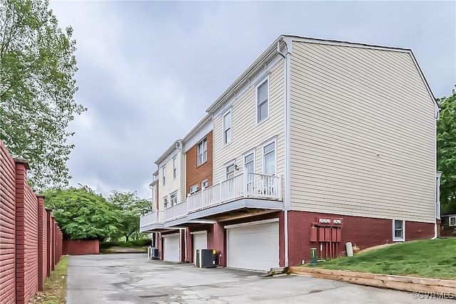 605 Spring St Unit P, Richmond, VA 23220 - view of building exterior with central AC and a garage