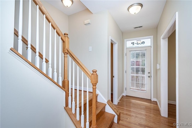 605 Spring St Unit P, Richmond, VA 23220 - foyer entrance featuring light wood-style flooring, baseboards, and stairs