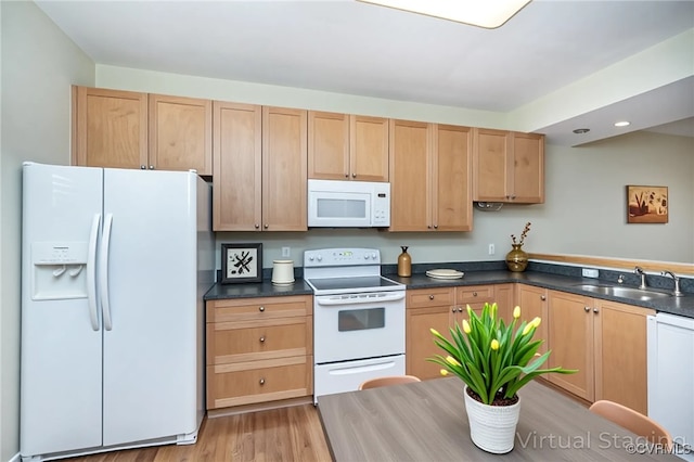 605 Spring St Unit P, Richmond, VA 23220 - kitchen featuring white appliances, a sink, dark countertops, light wood-type flooring, and light brown cabinetry