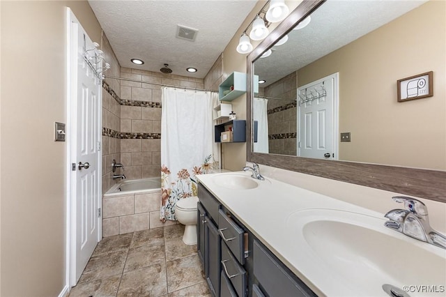 10701 Hamiltons Xing, Fredericksburg, VA 22408 - bathroom featuring a sink, toilet, tiled shower / bath combo, and a textured ceiling