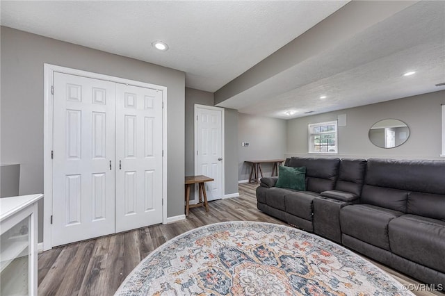 10701 Hamiltons Xing, Fredericksburg, VA 22408 - living room featuring a textured ceiling, baseboards, recessed lighting, and wood finished floors
