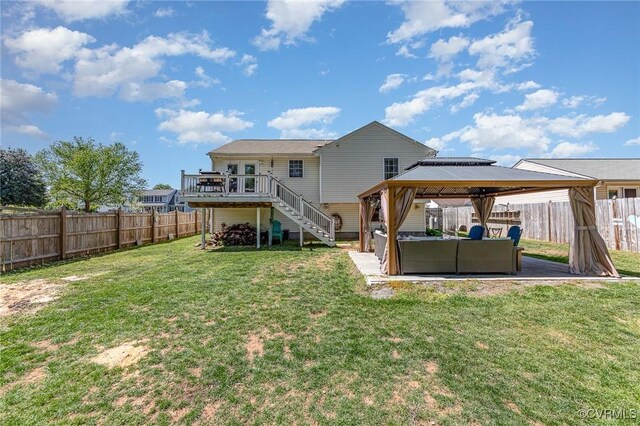 10701 Hamiltons Xing, Fredericksburg, VA 22408 - rear view of house featuring an outdoor living space, a deck, a gazebo, a fenced backyard, and stairs