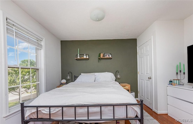 10701 Hamiltons Xing, Fredericksburg, VA 22408 - bedroom with multiple windows and wood finished floors