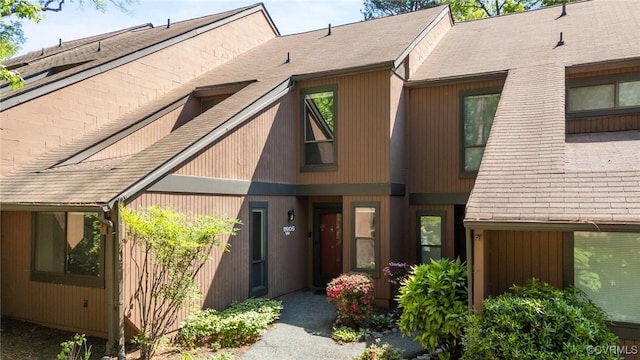 exterior space with a shingled roof
