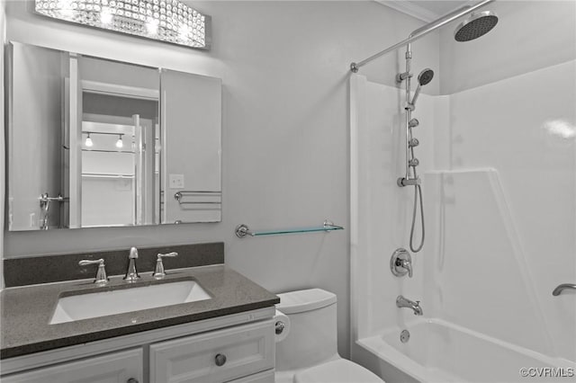 bathroom with toilet, shower / tub combination, and vanity