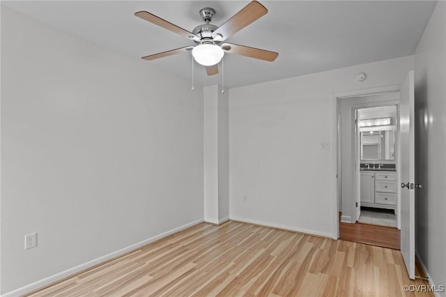 unfurnished bedroom with baseboards, ceiling fan, and light wood-style flooring