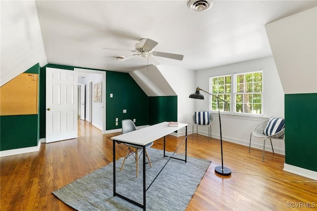 office with wood finished floors, vaulted ceiling, a ceiling fan, and baseboards