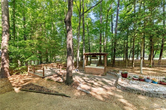view of yard featuring a patio area, fence, and a gazebo