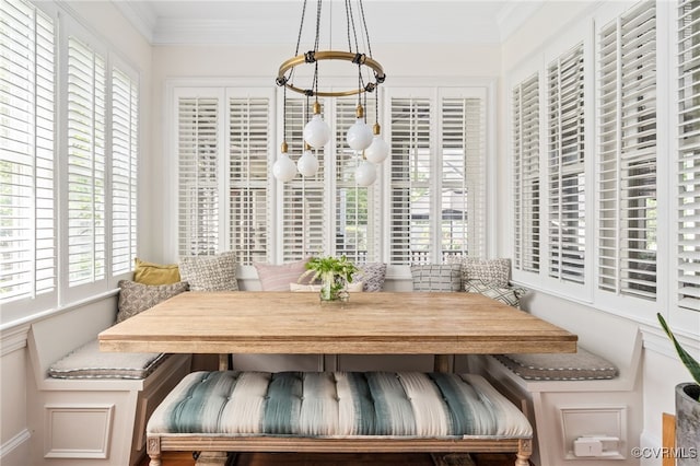 sunroom / solarium with a chandelier