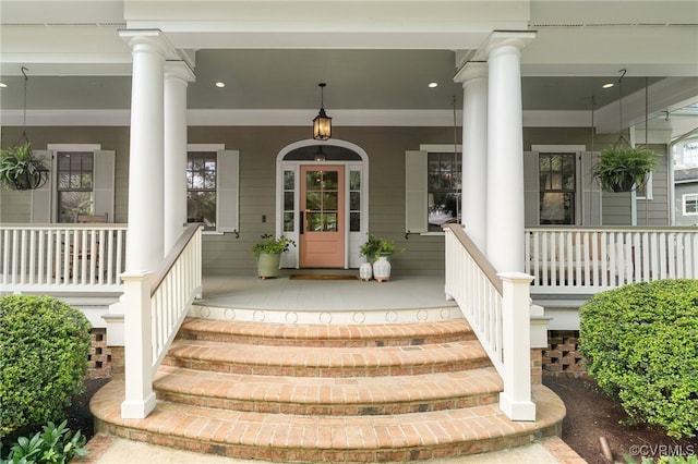 view of exterior entry with a porch