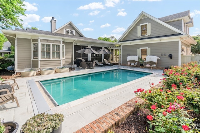 swimming pool featuring a patio