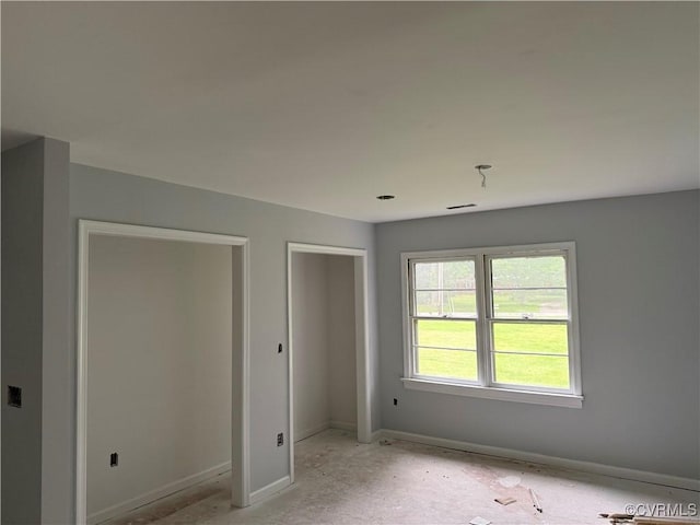 unfurnished bedroom featuring baseboards
