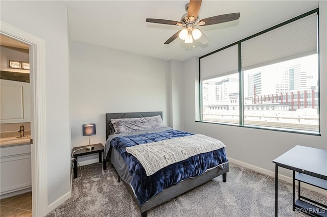 bedroom with carpet flooring, baseboards, and ceiling fan