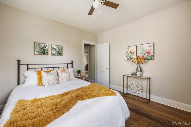 bedroom with baseboards, wood finished floors, and a ceiling fan